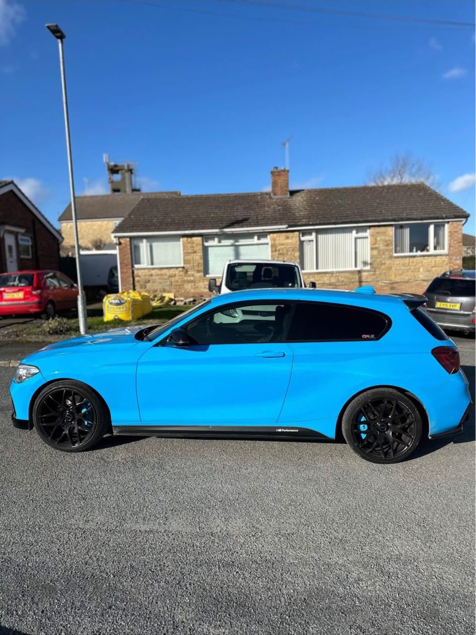 BMW 1 Series wrapped in gloss light blue, side profile