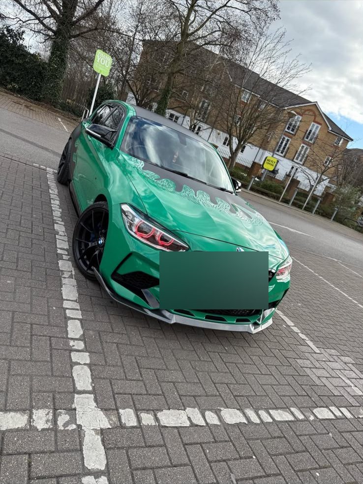 BMW wrapped in gloss green with a custom flame graphic over the bonnet